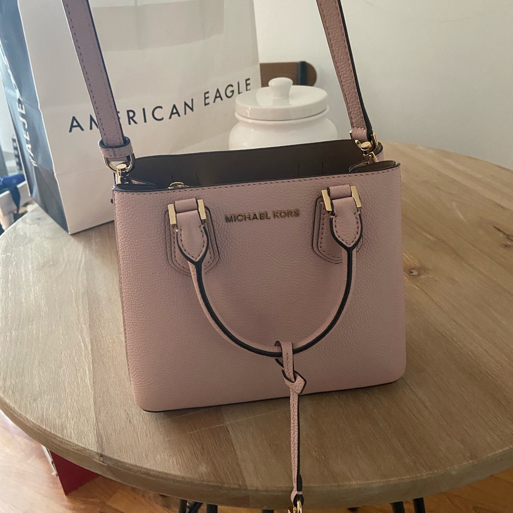 MK purse. Bought from MK store a year ago. Used MAYBE 2x, brand new